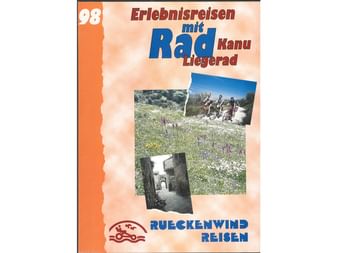 Titelseite des Rückenwind Radreisen Katalogs 1998 mit Blumenwiese, Radfahrern und historischem Gebäude, Text 'Erlebnisreisen mit Rad'.